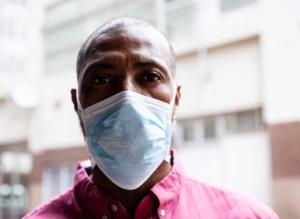 Black male with medical face mask