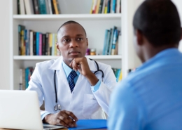 Man talking to gay friendly doctor