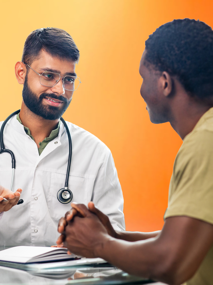 A healthcare provider speaks with a male patient. The patient smiles as he engages in the discussion. The background features a gradient of warm colors.